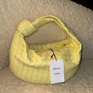 Bottega Venetta hand bag brand. We never been used